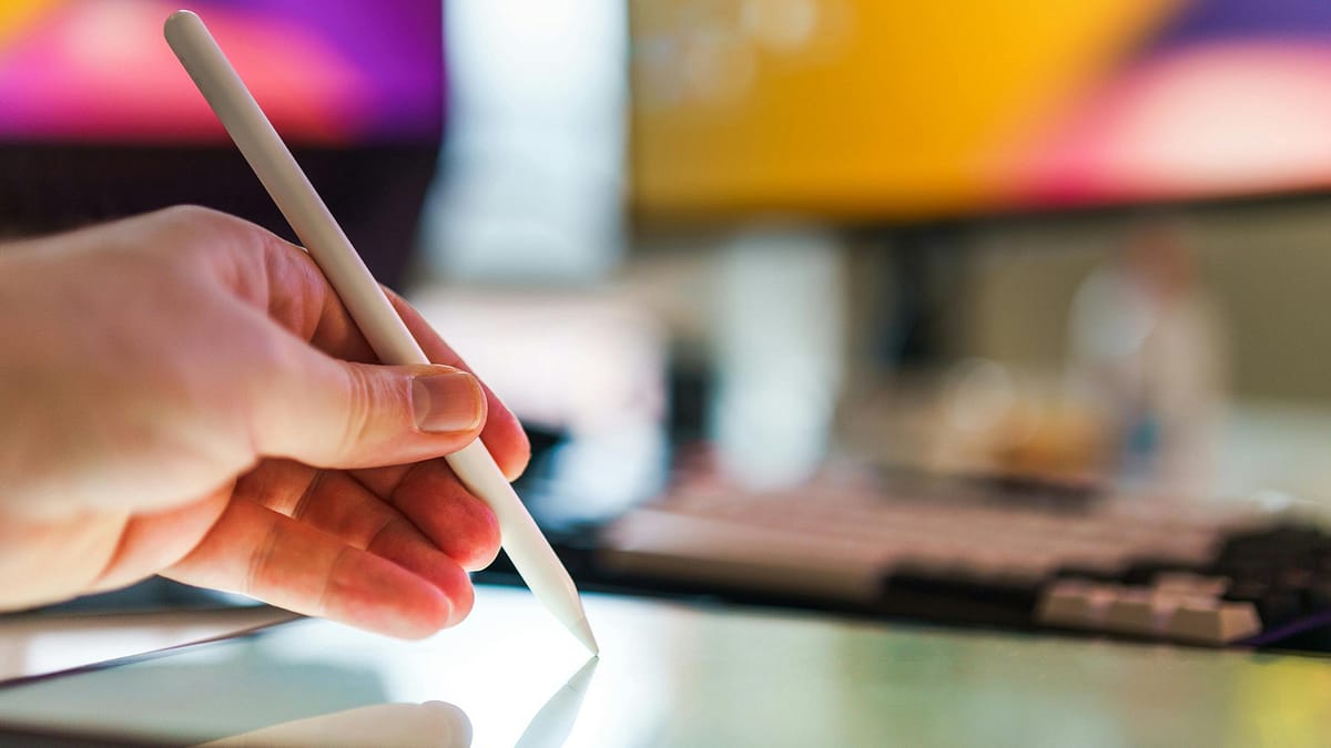 Will AI take your job – creative work with a tablet Will AI take your job – a creative specialist working on a digital tablet